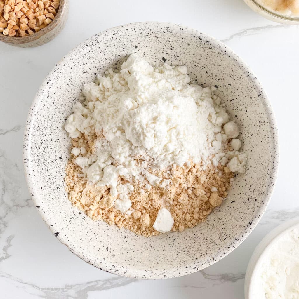Vanilla protein powder added to powdered peanut butter for energy bites