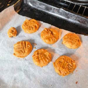 Baked powdered peanut butter cookies, ready to let cool and serve