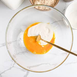 Greek yogurt added to beaten eggs and sweetener