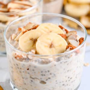 Healthy overnight oats with yogurt, topped with sliced banana and chopped almonds