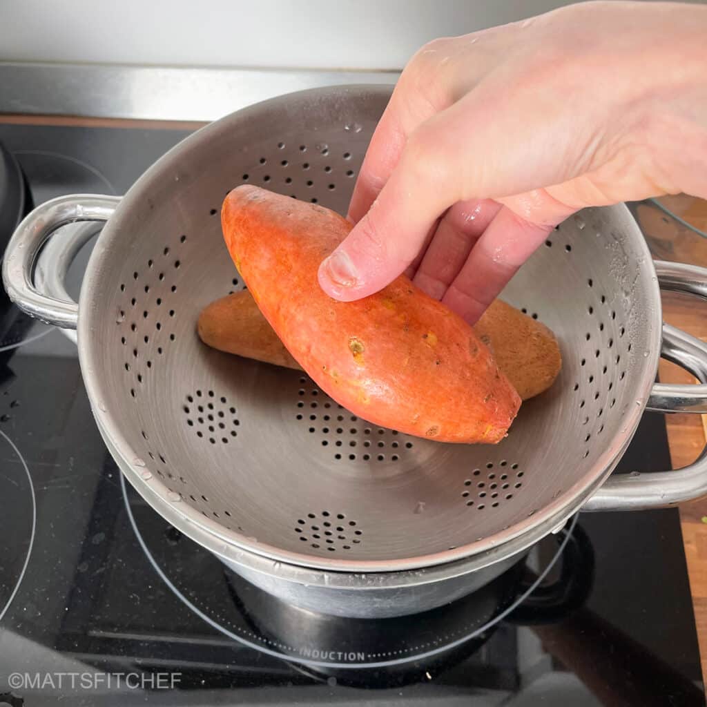 Adding sweet potatoes to strainer to steam for 30 minutes until tender