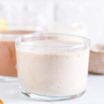 Front view of vanilla protein shake in transparent glasses
