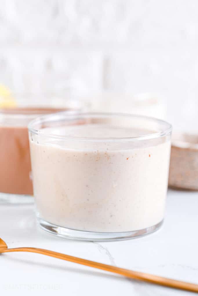 Front view of vanilla protein shake in transparent glasses