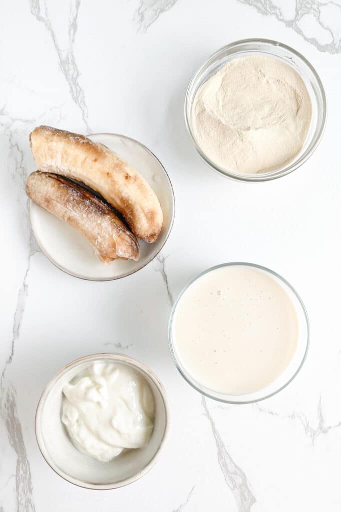 Vanilla Protein Shake Ingredients &ndash; Frozen banana, protein powder, milk, Greek yogurt and Vanilla extract