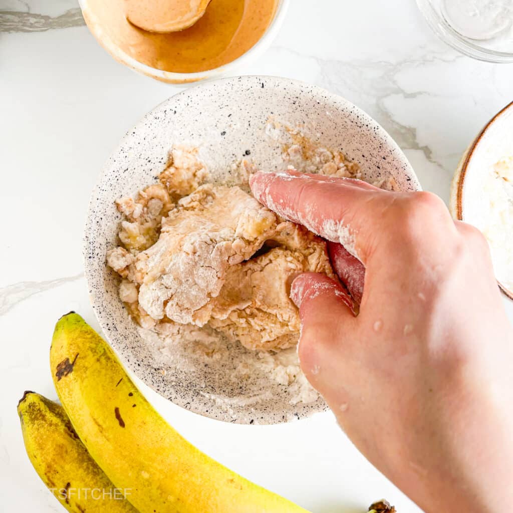 Kneading high protein banana dough with hands, until smooth
