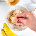 Shaping protein ball from banana dough using hands