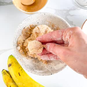 Shaping protein ball from banana dough using hands