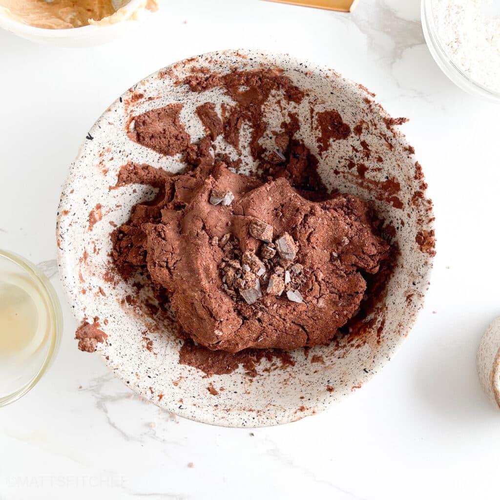 Dark chocolate chunks added to high protein brownie batter