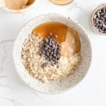 Chocolate chips added to peanut butter protein oatmeal ingredients