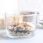 Powdered peanut butter with rolled oats and chia seeds in a glass