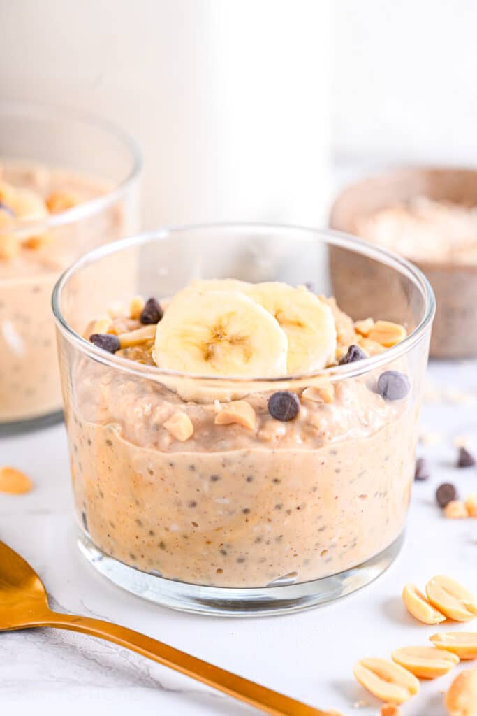 High protein overnight oats with powdered peanut butter in a serving glass