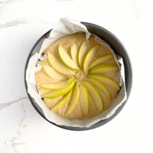 Baking dish with healthy apple cake batter before baking