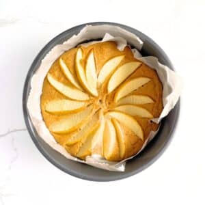 Baked apple protein cake topped with apple slices