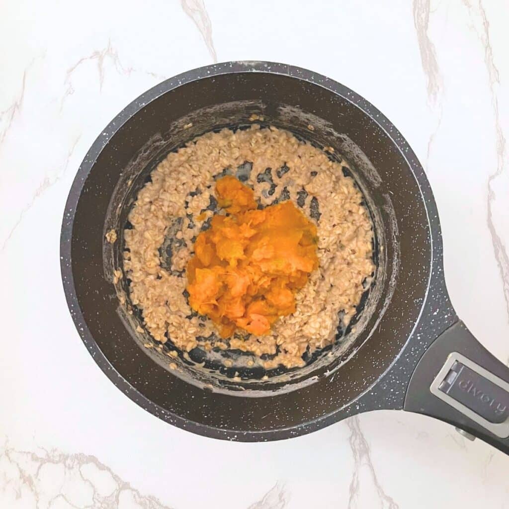Unsweetened pumpkin puree added to creamy oatmeal