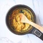 Creamy cooked pumpkin oatmeal in saucepan