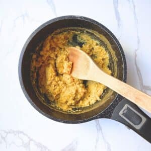 Creamy cooked pumpkin oatmeal in saucepan