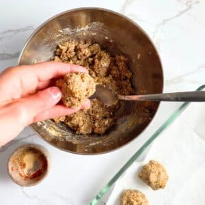 Shaping vegetarian meatballs from blended lentils using hands