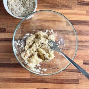 Mashed ripe bananas in bowl