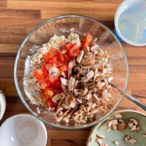 Diced tomatoes and sliced mushrooms added to cottage cheese oatmeal dough